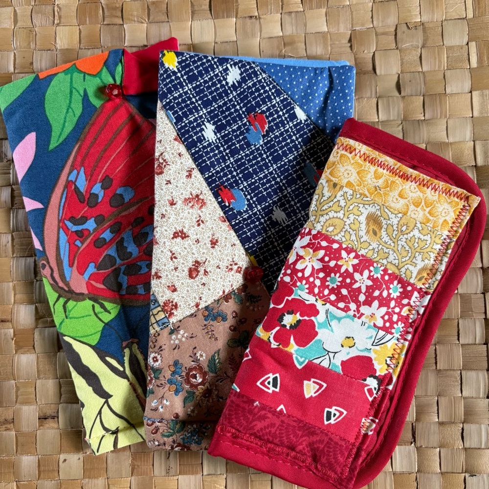 Three homemade eyeglass holders, different sizes and styles